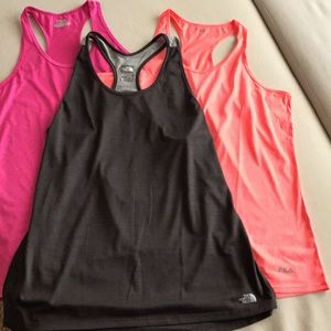 Three activewear tops, 2 FILA (pink/L) (coral/XL) and 1 NorthFace (gray/XL).